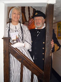 With husband Nigel in period naval costume.